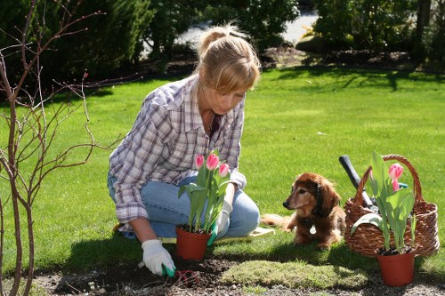 Technician performing compliant waste sorting and recycling during a garden maintenance visit