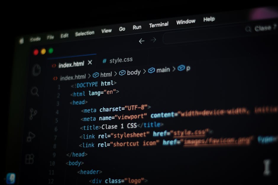 A computer screen displaying a code editor with HTML and CSS code visible, including tags such as <!DOCTYPE html>, <html>, <head>, <title>, and <meta>. The code is highlighted with different colors fo